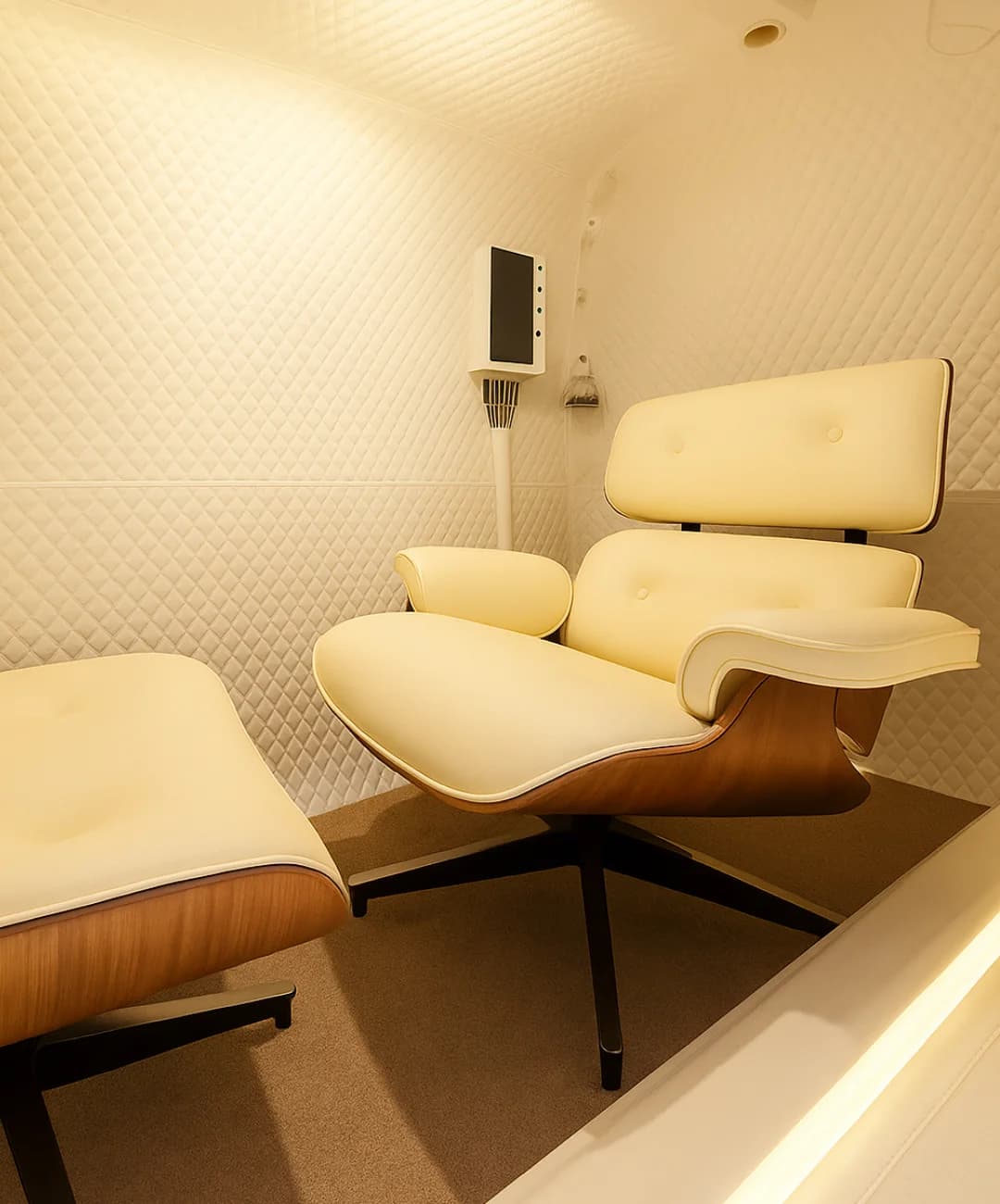 Apex Duo 5000 interior showing luxury Eames-style recliner and ambient lighting